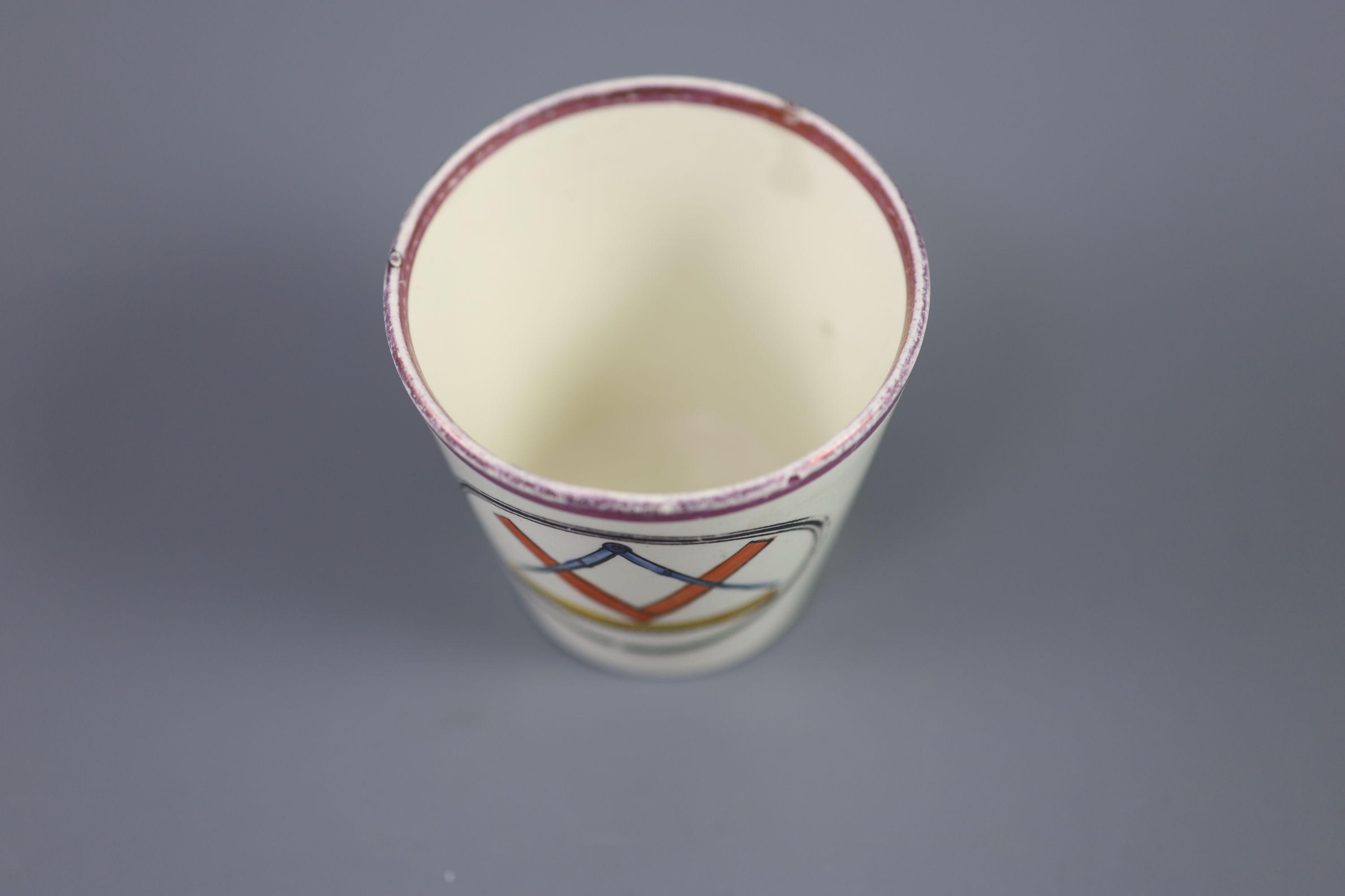 A rare pearlware Orangemen pink lustre beaker, c.1830, 7cm high